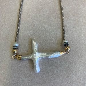 Handmade mother of pearl cross on a beaded chain